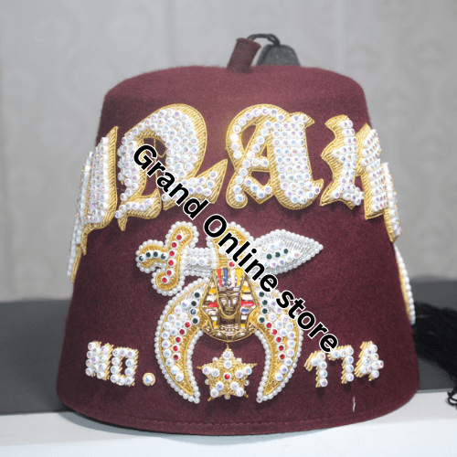 High-quality Shriner Fez adorned with symbolic emblems of the Shriner order. Classic Shriner Fez with intricate embroidery and gold accents.